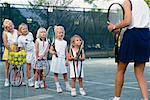 Tennis Instructor Teaching Kids