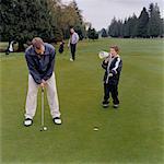 Boy Yelling at Father Trying to Golf