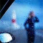 Woman Through Wet Car Window