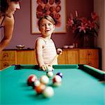 Mother and Daughter Playing Miniature Billiards