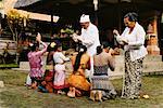 Hindu Priests Blessing Women Penestanan, Bali, Indonesia