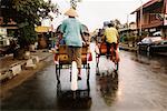 Rear View of People on Cycle Rickshaws Yogyakarta, Java, Indonesia