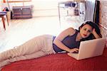 Woman on Bed with Laptop