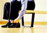 Man Tying Shoes