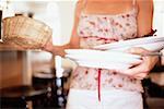 Waitress clearing table