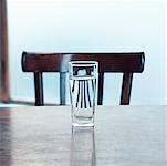 Image of Chair Refracted Through Glass of Water