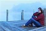 Woman Sitting on Docks