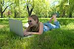 Girl Using Laptop in Park