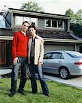 Couple in Front of Home and Car
