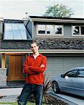 Man in Front of House and Car