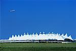 Airplane Flying Over Denver International Airport, Denver, COlorado, USA