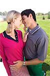 Couple Kissing at Golf Course