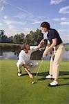 Man Teaching Woman To Putt