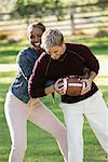 Couple Playing With Football