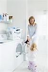 Mother and Daughter Doing Laundry