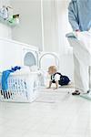 Father and Son in Laundry Room