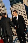 Businessmen Shaking Hands Outdoors