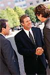 Businessmen Shaking Hands Outdoors