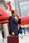 Businessman Outdoors, Talking On Cellular Phone