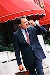 Businessman Outdoors, Talking On Cellular Phone
