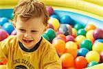 Boy Playing in Ball Pit