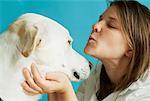 Woman Kissing Dog