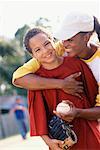 Portrait of Mother and Son Playing Baseball