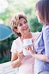 Mother and Daughter Drinking Tea