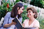 Women Looking at Photo Album