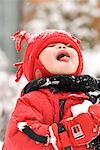 Boy Catching Snowflakes on Tongue