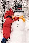 Boy Hugging Snowman