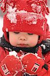 Boy Looking at Snow on Mitts