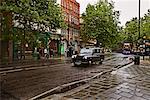 Taxi on Rainy Street in London, England