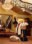 Two Women Looking at Chandelier in Hotel Lobby