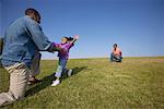 Mother, Father and Daughter Outdoors