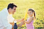 Father Playing T-ball with Daughter