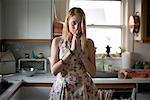 Portrait of Woman Standing In Kitchen