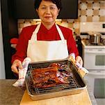 Woman Making Roast Duck