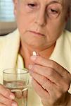 Woman Holding Pill