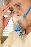 Woman Using Oxygen Mask