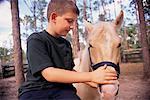 Boy Petting Horse