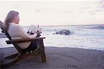 Woman Reading on Beach