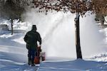 Man Operating a Snowblower