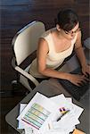 Woman Typing On Laptop At Desk