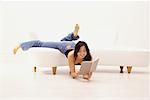 Woman Lying on Sofa and Reading