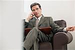 Businessman with Cell Phone and Day Timer