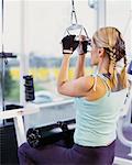 Woman Exercising in Gym