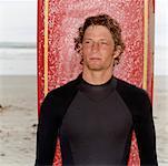 Man With Surfboard On the Beach