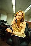 Businesswoman Using Telephone in Office