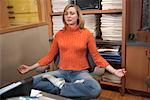 Woman Meditating in Office